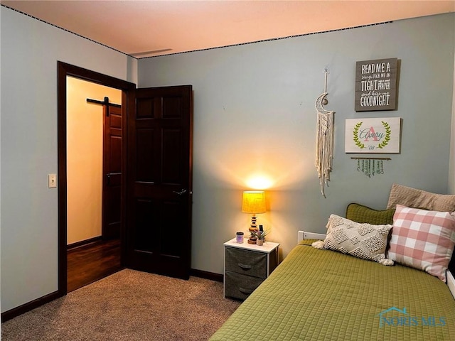 41 Salome Cir, Bluffton, OH 45817 - carpeted bedroom with a barn door and baseboards