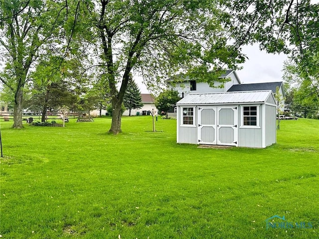 41 Salome Cir, Bluffton, OH 45817 - view of grassy yard featuring a shed and an outbuilding