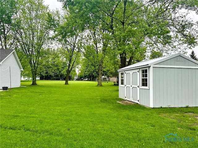 41 Salome Cir, Bluffton, OH 45817 - view of green lawn featuring an outbuilding and a shed