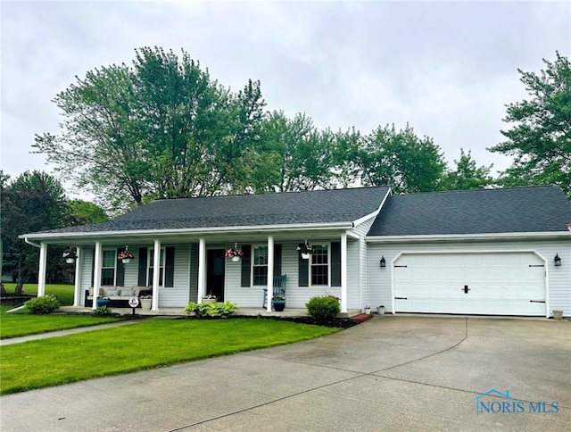 41 Salome Cir, Bluffton, OH 45817 - ranch-style home with covered porch, driveway, a garage, and a front lawn