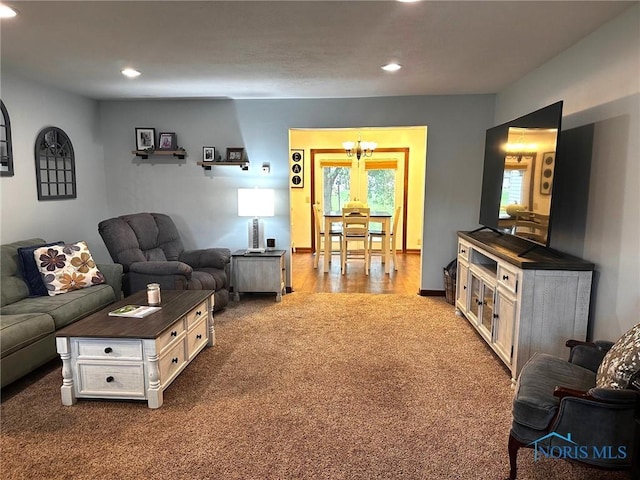 41 Salome Cir, Bluffton, OH 45817 - living area with dark carpet, recessed lighting, a chandelier, and baseboards