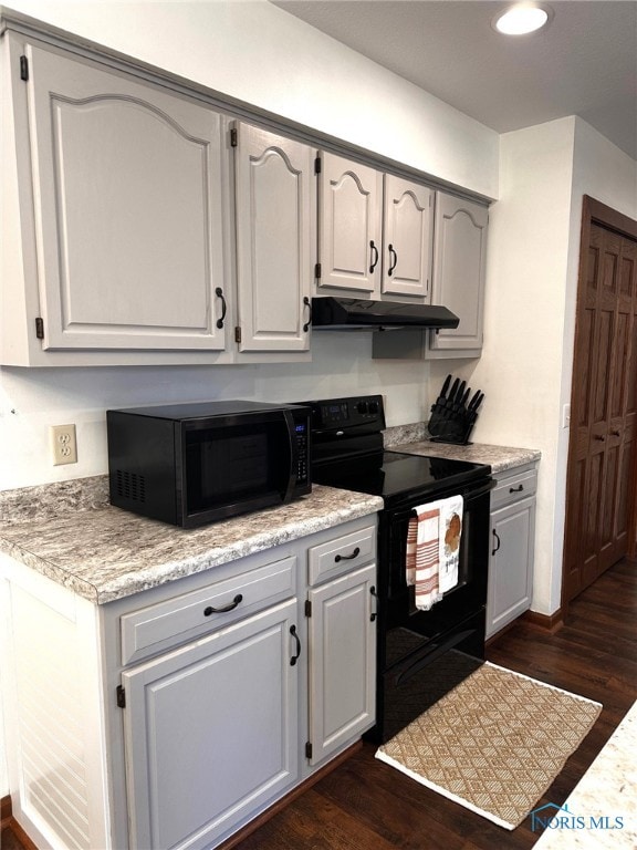 41 Salome Cir, Bluffton, OH 45817 - kitchen featuring black appliances, dark wood finished floors, under cabinet range hood, light countertops, and recessed lighting