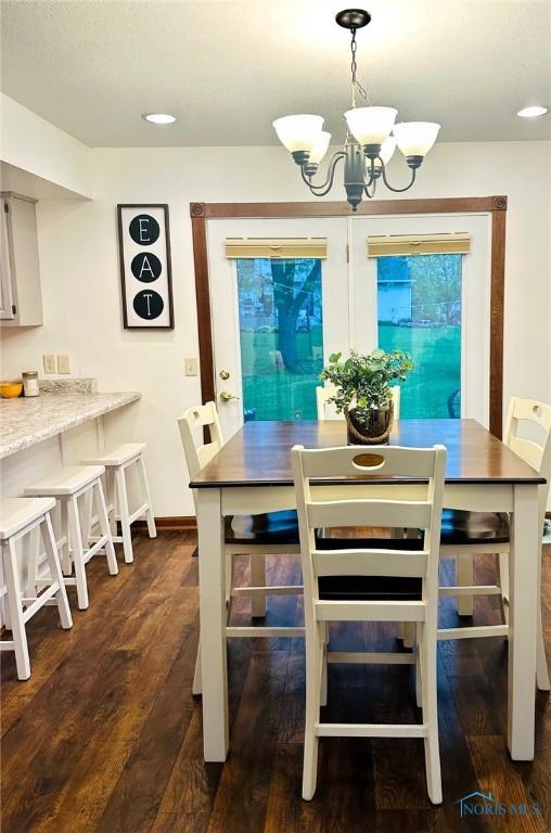41 Salome Cir, Bluffton, OH 45817 - dining area with a chandelier, dark wood-type flooring, baseboards, and recessed lighting