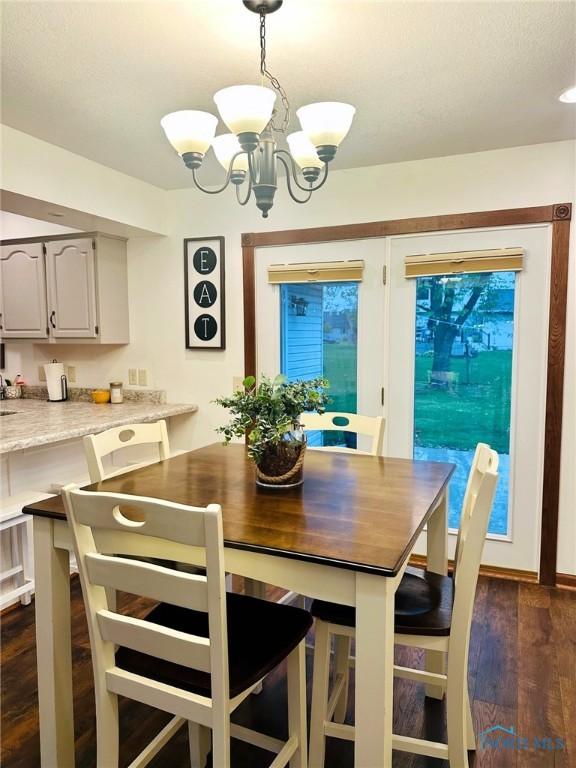 41 Salome Cir, Bluffton, OH 45817 - dining room featuring a chandelier and dark wood-style floors