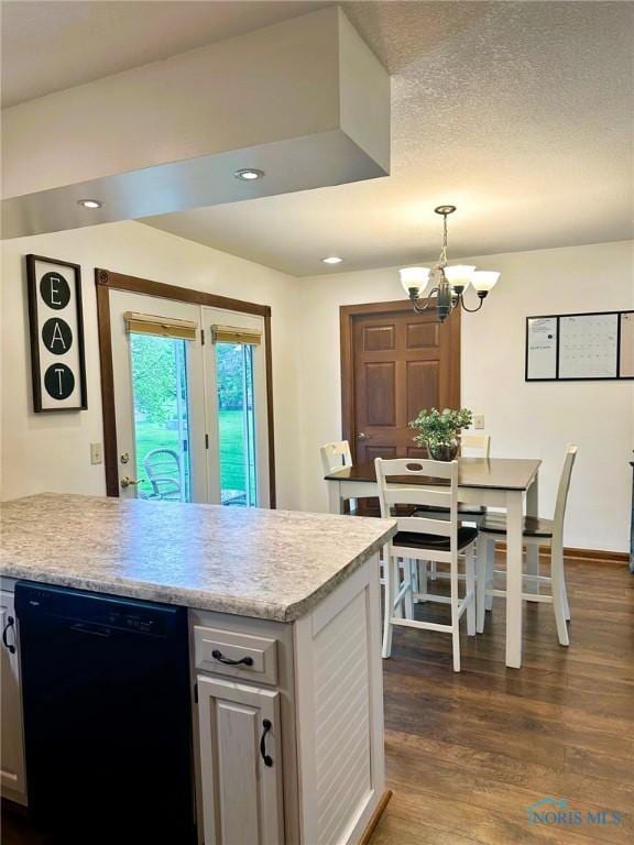 41 Salome Cir, Bluffton, OH 45817 - kitchen featuring black dishwasher, light countertops, a chandelier, dark wood-type flooring, and pendant lighting