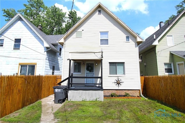 818 Geneva Ave, Toledo, OH 43609 - rear view of house featuring a fenced backyard