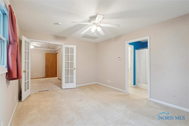 1208 Lindau St, Archbold, OH 43502 - spare room with french doors, carpet flooring, ceiling fan, and baseboards