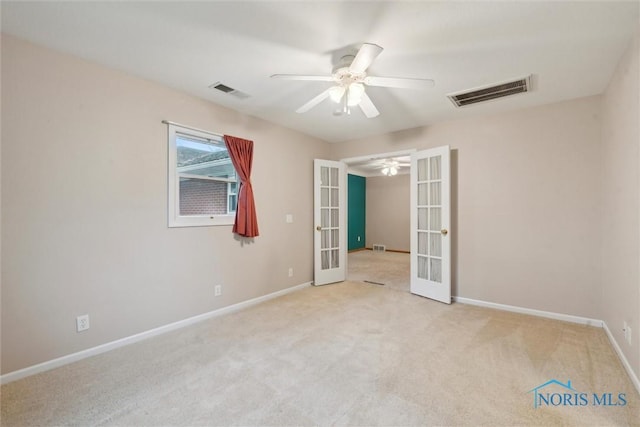 1208 Lindau St, Archbold, OH 43502 - unfurnished bedroom with french doors, carpet flooring, baseboards, and a ceiling fan
