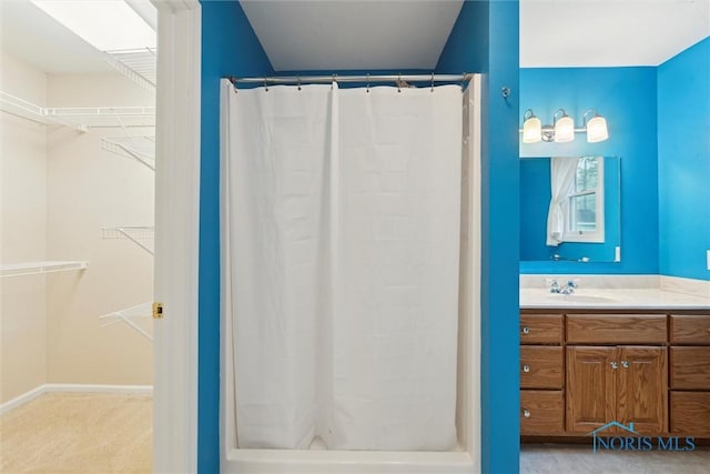 1208 Lindau St, Archbold, OH 43502 - full bathroom with a shower with shower curtain, vanity, and a spacious closet