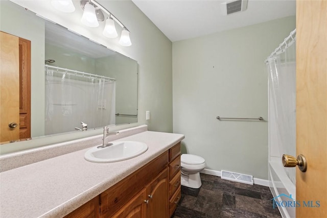 1208 Lindau St, Archbold, OH 43502 - bathroom with stone finish flooring, baseboards, toilet, and vanity