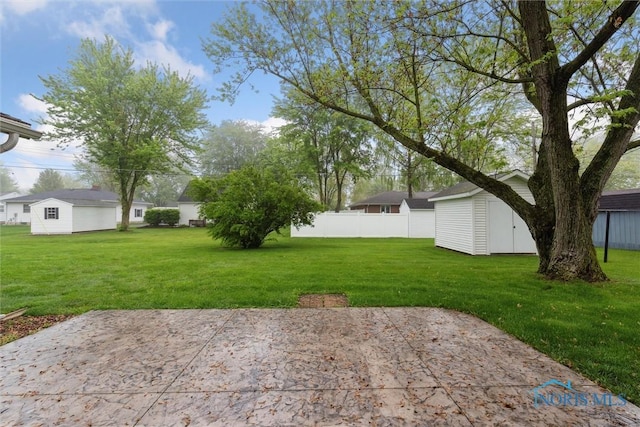 1208 Lindau St, Archbold, OH 43502 - view of yard with an outbuilding, a patio area, and a storage shed