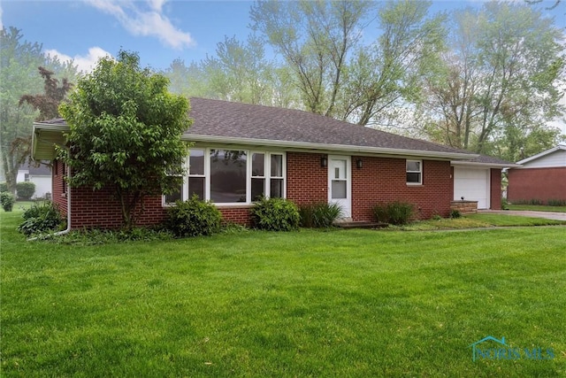 1208 Lindau St, Archbold, OH 43502 - single story home featuring brick siding, a garage, and a front yard