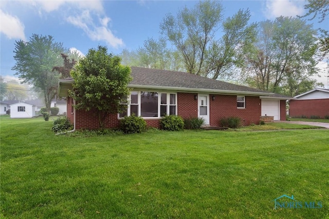 1208 Lindau St, Archbold, OH 43502 - ranch-style home with a garage, brick siding, a front yard, and concrete driveway