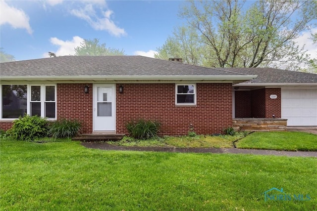 1208 Lindau St, Archbold, OH 43502 - ranch-style home featuring an attached garage, a front yard, brick siding, and roof with shingles
