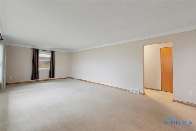 1208 Lindau St, Archbold, OH 43502 - spare room with ornamental molding, light colored carpet, and baseboards