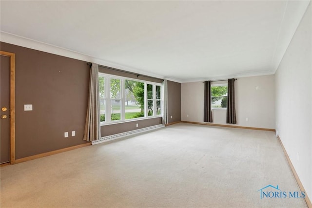 1208 Lindau St, Archbold, OH 43502 - empty room with baseboard heating, light colored carpet, and baseboards