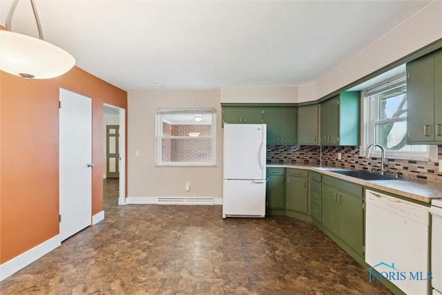 1208 Lindau St, Archbold, OH 43502 - kitchen with green cabinetry, white appliances, a sink, decorative backsplash, and light countertops