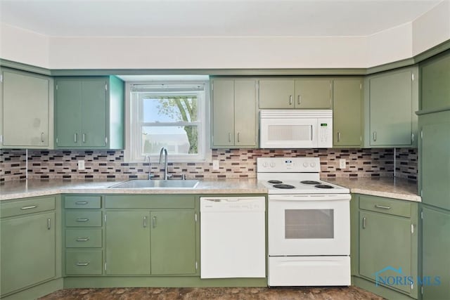 1208 Lindau St, Archbold, OH 43502 - kitchen with white appliances, a sink, light countertops, and decorative backsplash