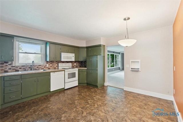 1208 Lindau St, Archbold, OH 43502 - kitchen with a sink, white appliances, green cabinetry, backsplash, and baseboards