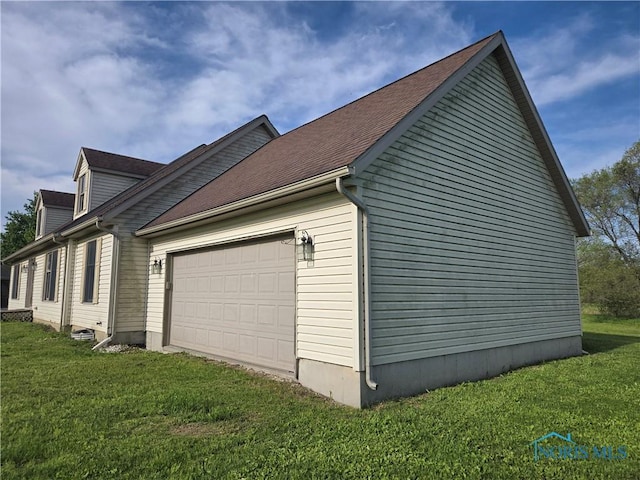 5924 N Reiman Rd, Curtice, OH 43412 - view of side of home featuring a garage and a yard