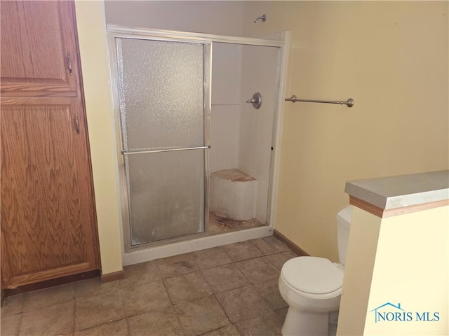 5924 N Reiman Rd, Curtice, OH 43412 - full bathroom with toilet, a stall shower, and baseboards
