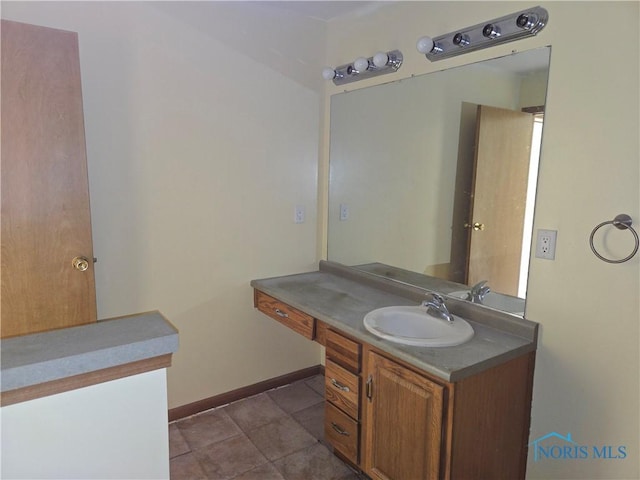 5924 N Reiman Rd, Curtice, OH 43412 - bathroom featuring vanity, baseboards, and tile patterned flooring