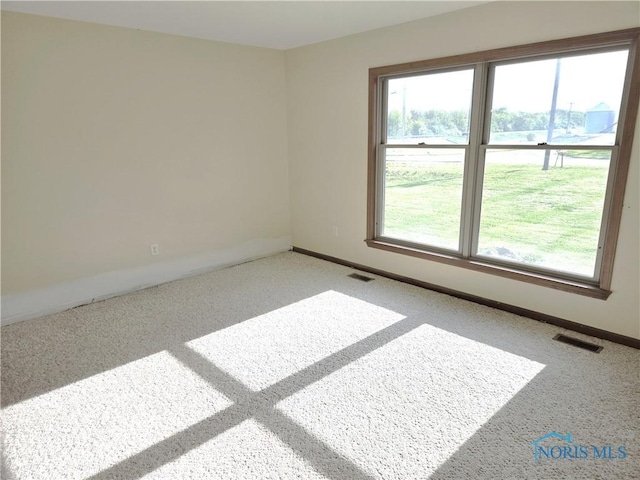 5924 N Reiman Rd, Curtice, OH 43412 - carpeted empty room with baseboards