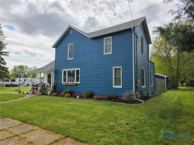 129 Stahl St, Bradner, OH 43406 - view of home's exterior with a lawn