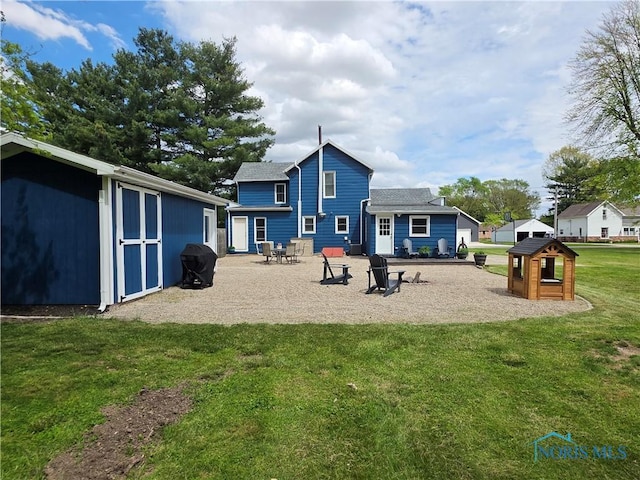 129 Stahl St, Bradner, OH 43406 - back of property with a yard and a patio