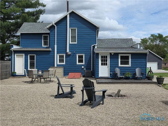 129 Stahl St, Bradner, OH 43406 - rear view of house with a shingled roof and a wooden deck