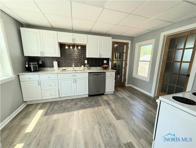 129 Stahl St, Bradner, OH 43406 - kitchen with stainless steel dishwasher, electric stove, a sink, baseboards, and a paneled ceiling