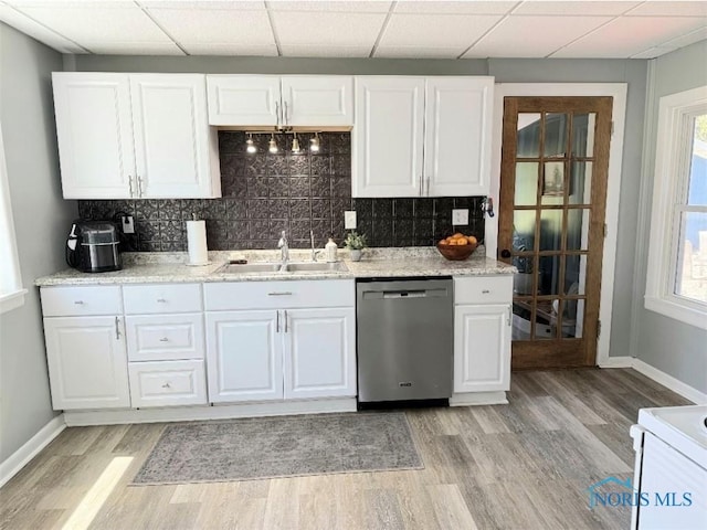 129 Stahl St, Bradner, OH 43406 - kitchen with stainless steel dishwasher, a sink, range, light wood finished floors, and baseboards