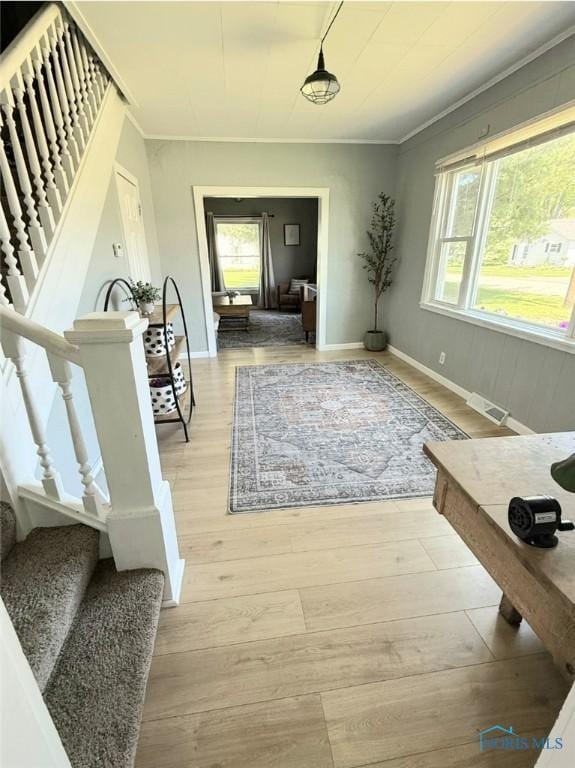 129 Stahl St, Bradner, OH 43406 - foyer featuring stairway, ornamental molding, light wood-type flooring, and baseboards