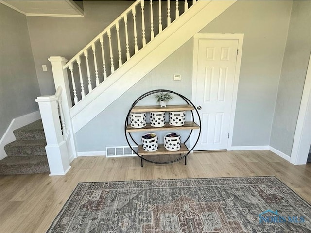 129 Stahl St, Bradner, OH 43406 - staircase featuring wood finished floors and baseboards