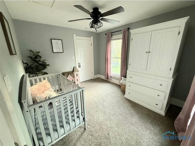 129 Stahl St, Bradner, OH 43406 - bedroom with light carpet, a ceiling fan, and baseboards