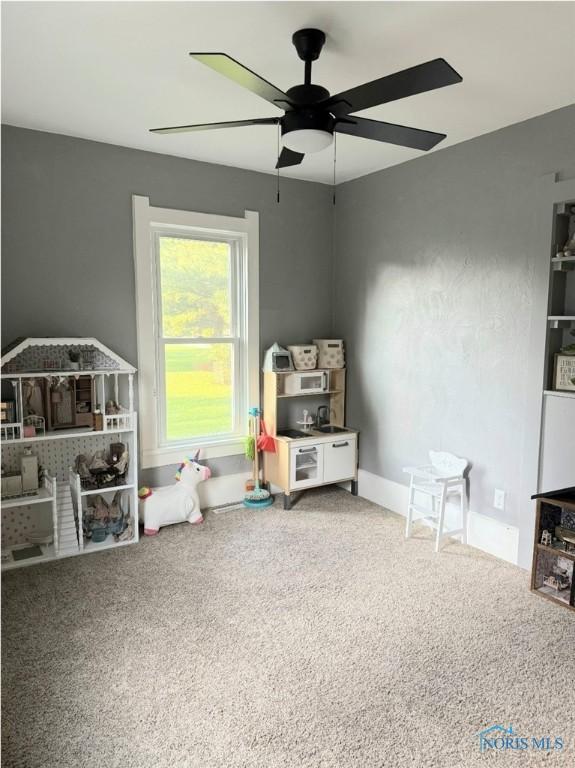 129 Stahl St, Bradner, OH 43406 - playroom featuring a ceiling fan and carpet flooring