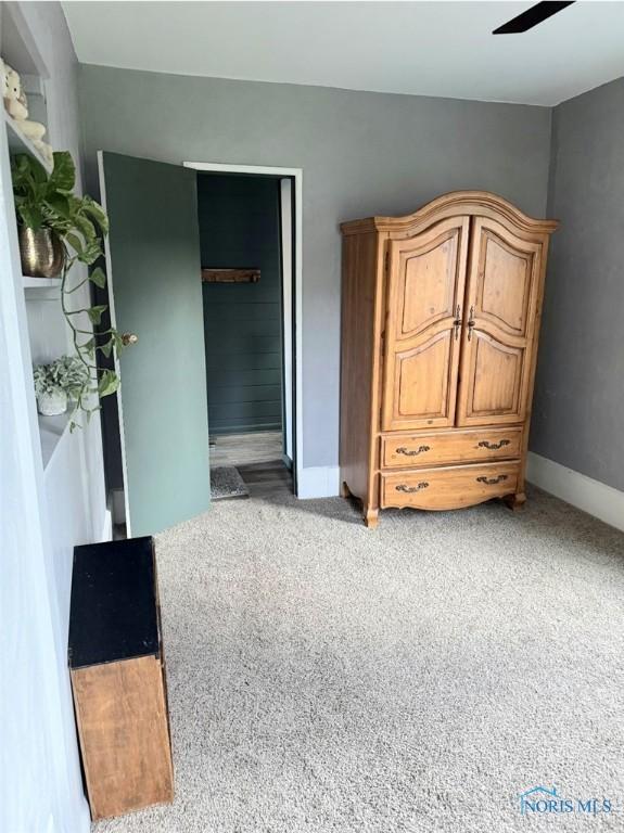129 Stahl St, Bradner, OH 43406 - bedroom featuring baseboards and light carpet
