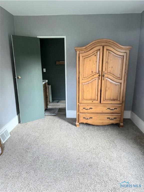 129 Stahl St, Bradner, OH 43406 - carpeted bedroom featuring baseboards