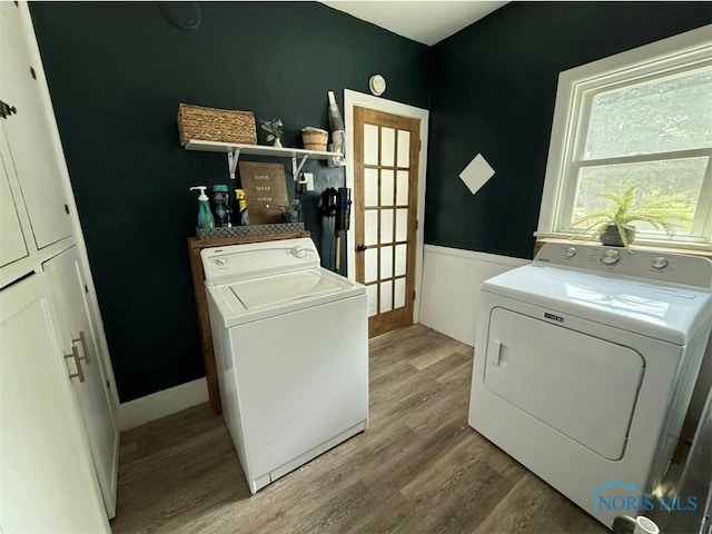 129 Stahl St, Bradner, OH 43406 - washroom with separate washer and dryer, light wood-style flooring, and baseboards