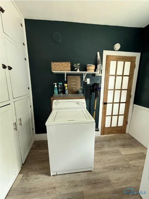 129 Stahl St, Bradner, OH 43406 - laundry area featuring washer / clothes dryer, wood finished floors, and cabinet space