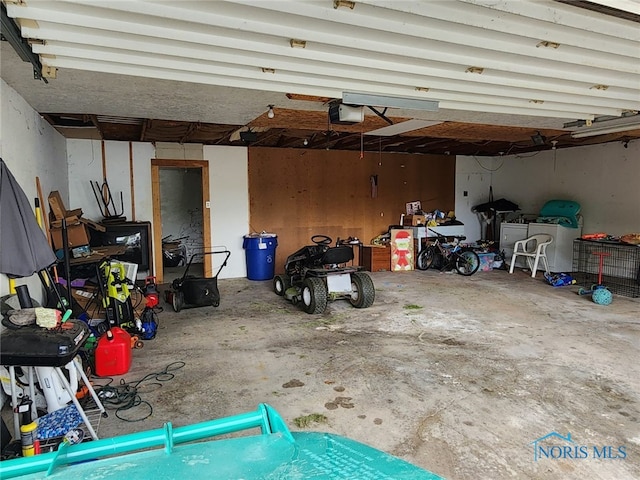713 Glenwood Rd, Rossford, OH 43460 - garage featuring a garage door opener