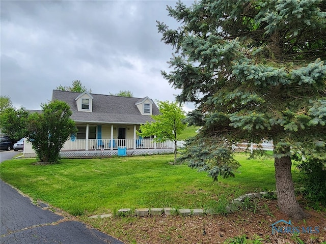 713 Glenwood Rd, Rossford, OH 43460 - cape cod home with a porch, a front lawn, and a shingled roof