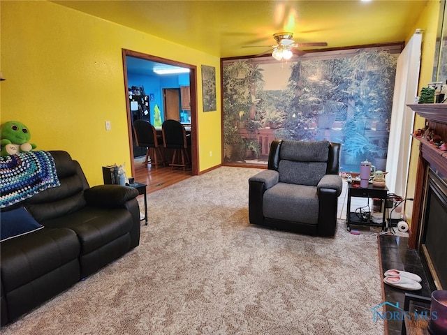 713 Glenwood Rd, Rossford, OH 43460 - living room with carpet floors, a ceiling fan, and a fireplace with flush hearth