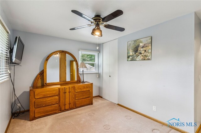 832 Maple Ln, Waterville, OH 43566 - bedroom with carpet floors, a closet, baseboards, and ceiling fan