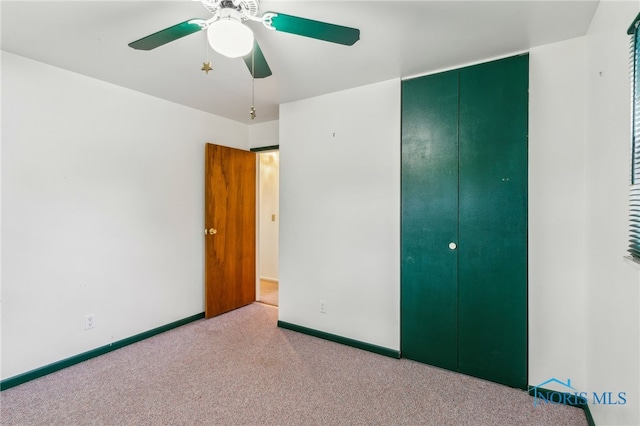 832 Maple Ln, Waterville, OH 43566 - unfurnished bedroom featuring carpet flooring, baseboards, ceiling fan, and a closet