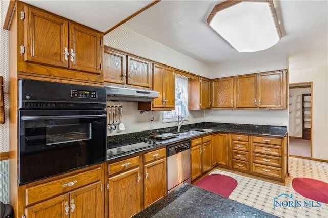 832 Maple Ln, Waterville, OH 43566 - kitchen featuring black appliances, under cabinet range hood, brown cabinetry, and a sink
