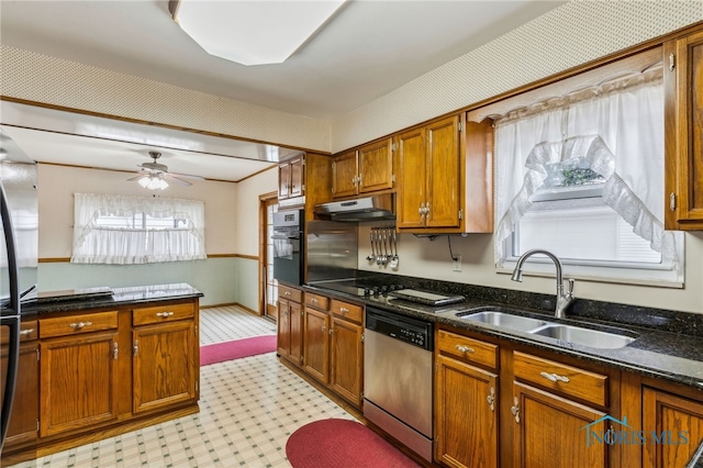 832 Maple Ln, Waterville, OH 43566 - kitchen featuring dishwasher, a sink, under cabinet range hood, wall oven, and light floors