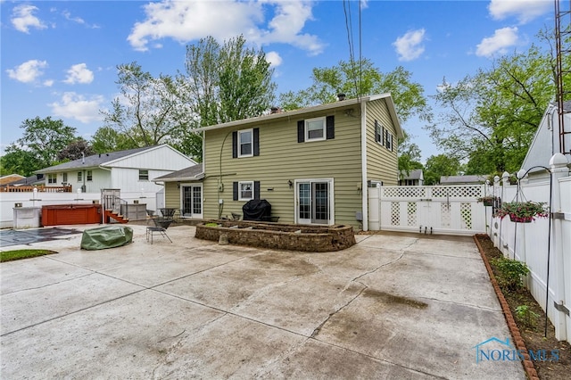 832 Maple Ln, Waterville, OH 43566 - rear view of property with a hot tub, a patio area, and a fenced backyard