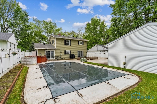 832 Maple Ln, Waterville, OH 43566 - view of swimming pool with a patio, a hot tub, and a fenced backyard
