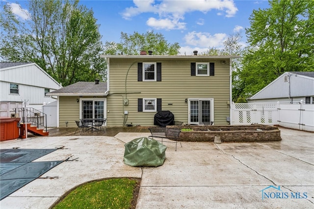832 Maple Ln, Waterville, OH 43566 - back of property with a patio, a chimney, french doors, and a pool